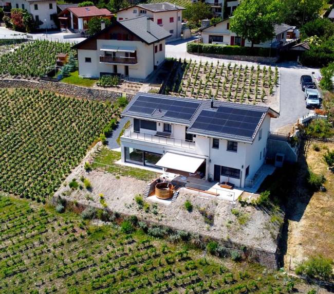solar panels on the roof of a house in Switzerland