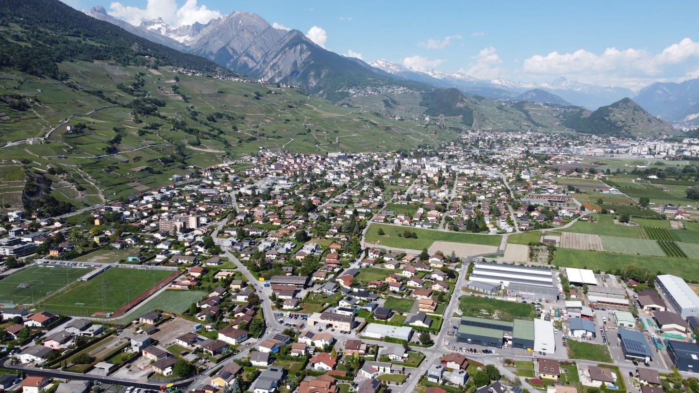 Two houses in Switzerland with solar panels on the roof