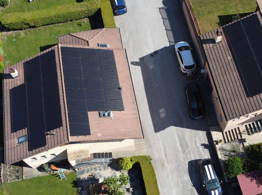 Two houses in Switzerland with solar panels on the roof
